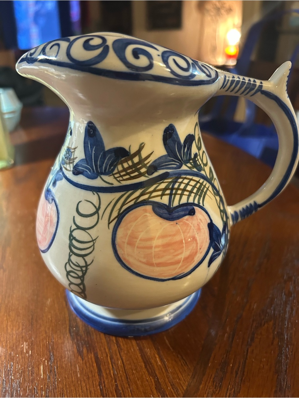 Hand-Painted Ceramic Pitcher with Blue and Peach Fruit Motif